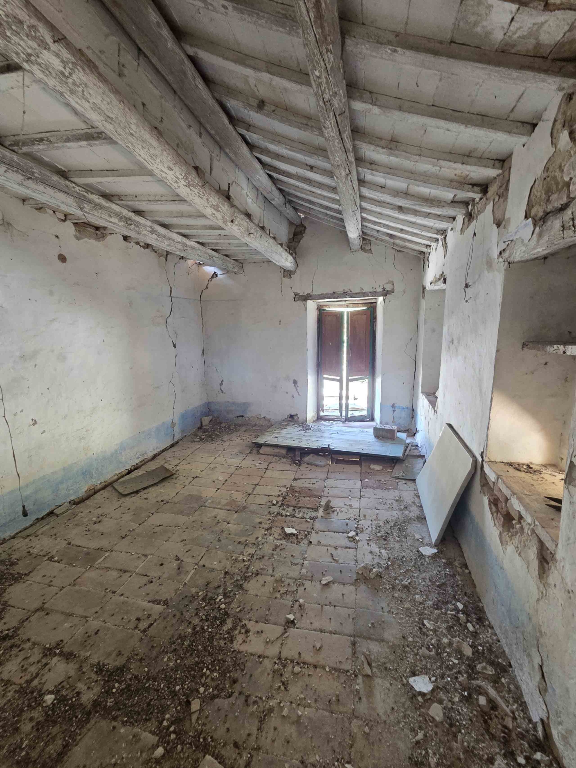 Stone country house in Massignano