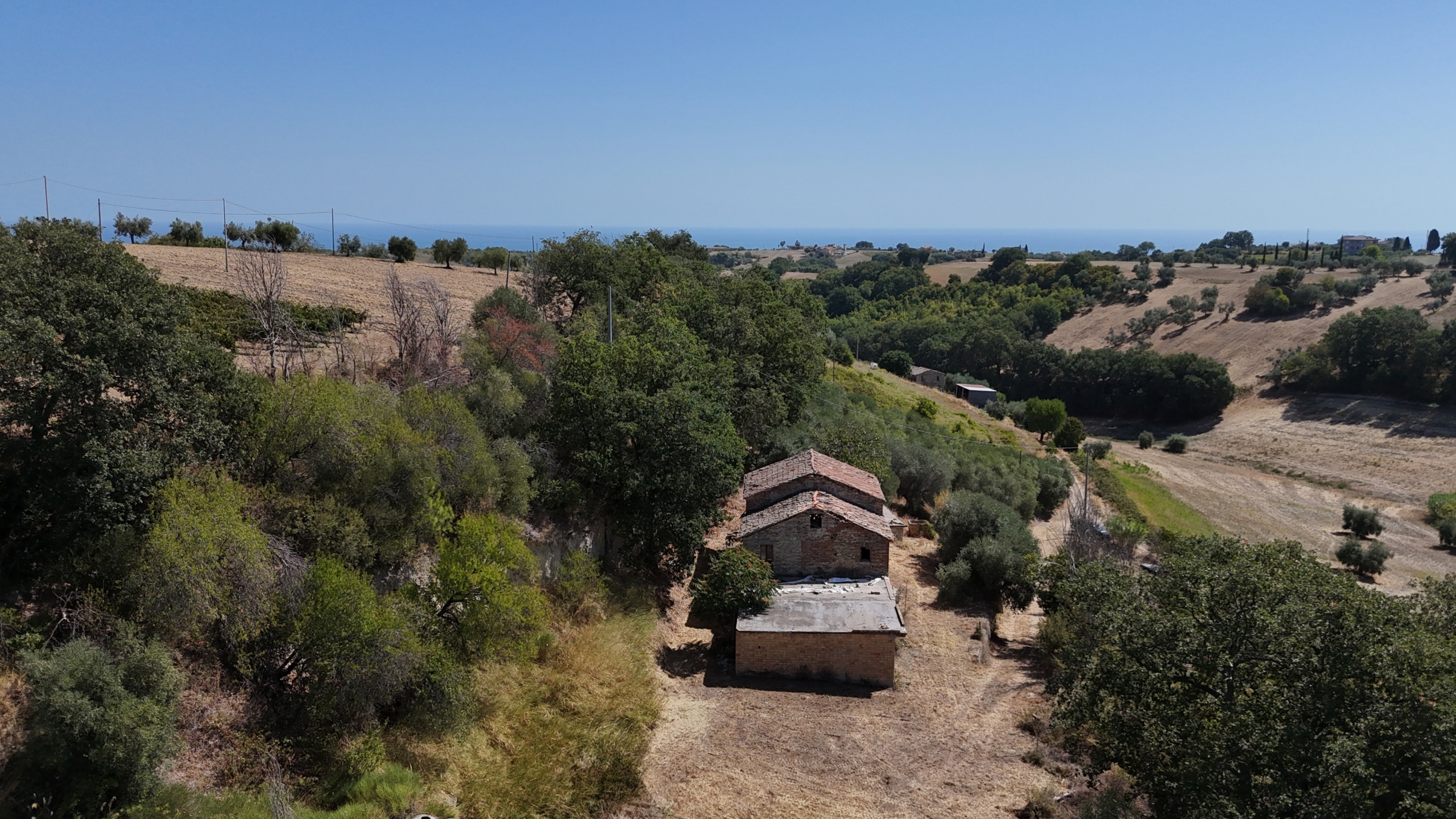Stone country house in Massignano